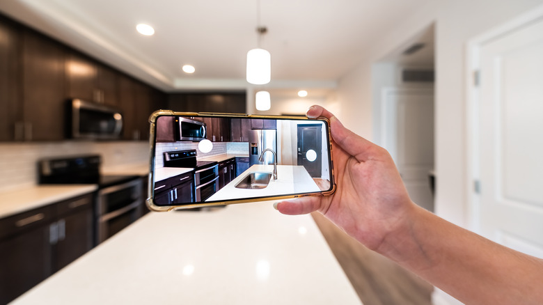 Person taking a photo of the kitchen