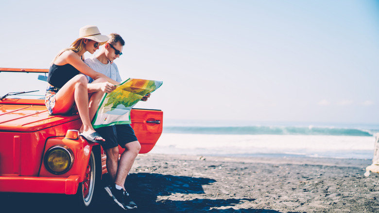 Couple read a map